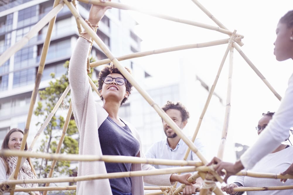 low angle view of colleagues in team building task