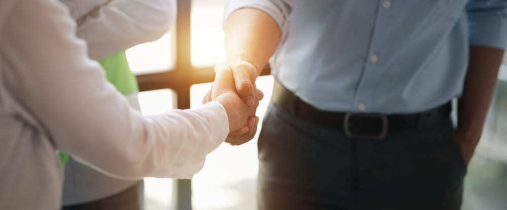 team engineers shake hands